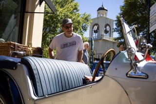 photo man admiring vehicle