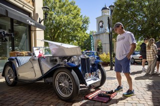 photo man admiring vehicle